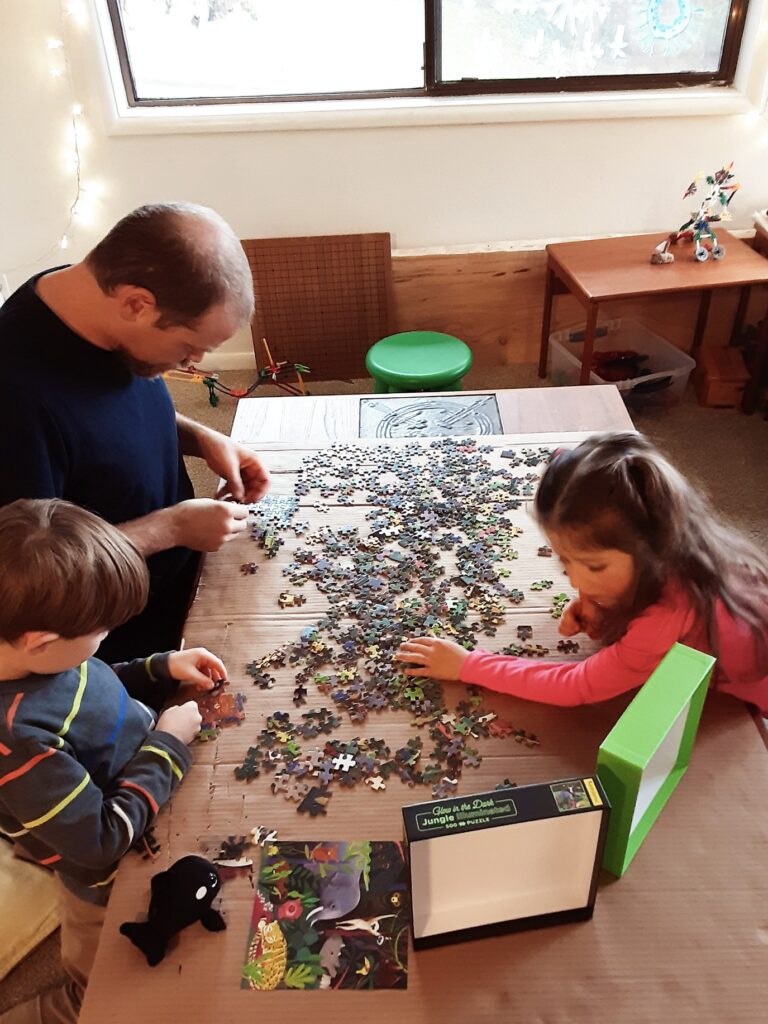 Family doing a jigsaw puzzle
