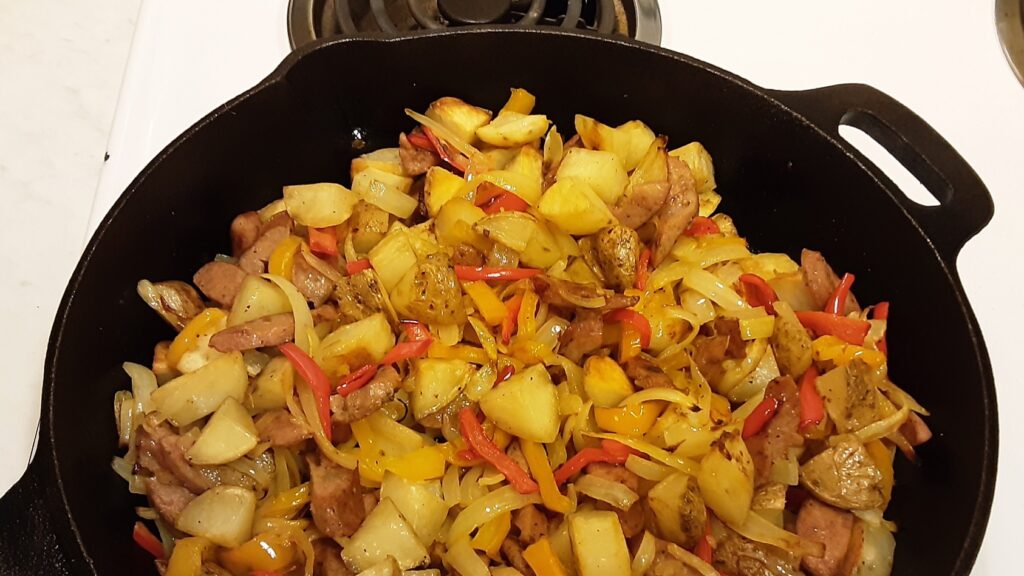 Potatoes and sausage with onions and bell peppers